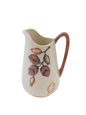 Lot 628 - A Carlton ware jug, decorated with leaves in...