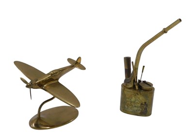 Lot 629 - A brass Spitfire desk ornament, with label for...