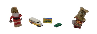 Lot 632 - A collection of toys, to include a wind up...