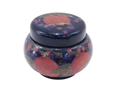 Lot 633 - A Moorcroft pottery jar and cover, decorated...