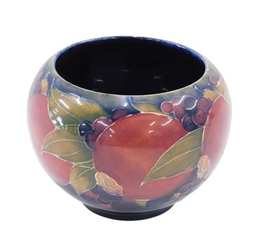 Lot 634 - A Moorcroft pottery Pomegranate bowl, on a...