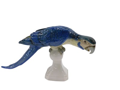 Lot 635 - A Royal Dux porcelain parrot, 21cm high, 42cm...