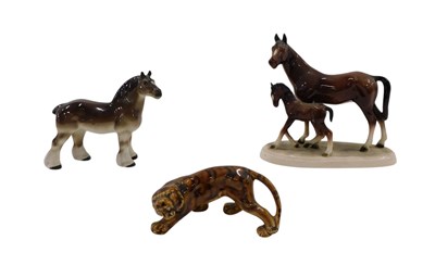 Lot 638 - A ceramic horse and foal group, a ceramic...