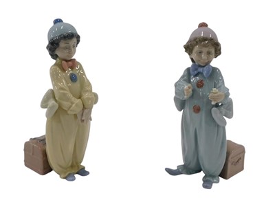 Lot 647 - Two Lladro porcelain figures of clowns, 20cm...