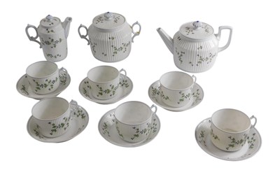 Lot 650 - A French porcelain part tea service, decorated...