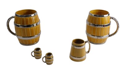 Lot 651 - A pair of large Wade barrel shaped mugs, 19cm...