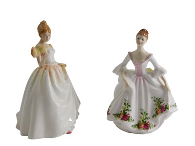 Lot 704 - Two Royal Doulton figurines, Gift of Love, and...