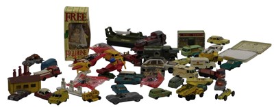 Lot 679 - Diecast playworn vehicles and buildings, to...