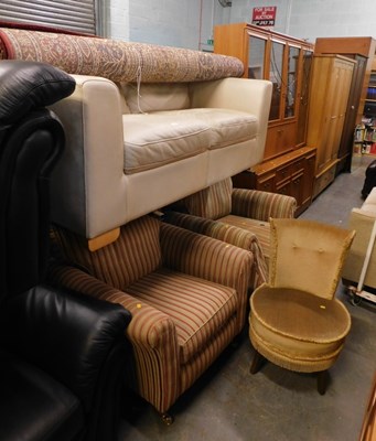 Lot 1617 - A cream leather two seater settee, on block...