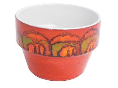 Lot 741 - A Poole pottery orange glazed planter, 11cm high.