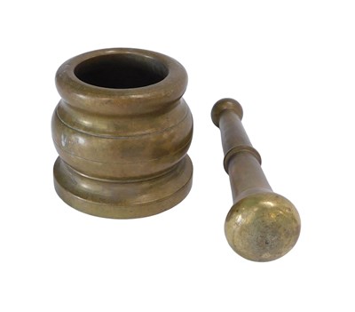 Lot 721 - A small brass pestle and mortar, 8cm high.