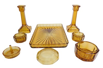 Lot 724 - A 1960s amber glass dressing table...