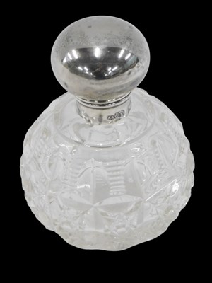 Lot 250 - A cut glass silver topped scent bottle, of...