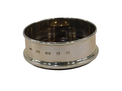 Lot 752 - A silver and mahogany small wine glass coaster,...