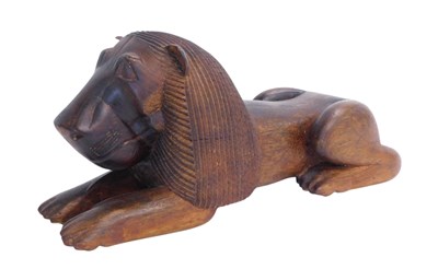Lot 397 - A South American hardwood carving of a lion,...
