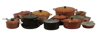 Lot 828 - A quantity of Le Creuset orange enamel pans,...
