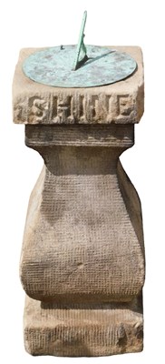 Lot 849 - A carved stone and copper sundial, 64cm high.