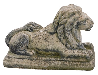 Lot 853 - A composition recumbent lion statue, on a...