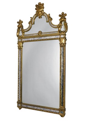 Lot 884 - A Continental gilt wall mirror, with a shaped...