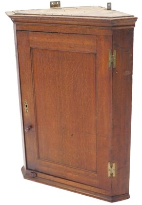 Lot 886 - A late 19thC oak hanging corner cabinet, with...