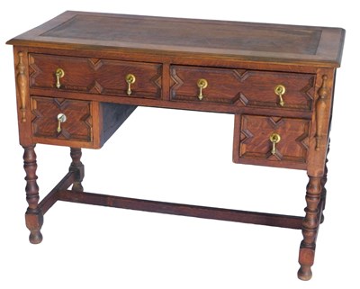 Lot 1165 - A 1920s oak desk, the rectangular top with a...