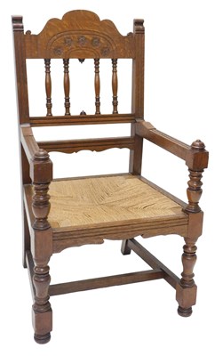 Lot 1174 - An early 20thC carved oak throne type chair,...