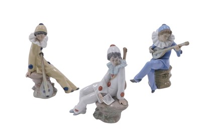 Lot 619 - Three Nao porcelain Pierrot figures, to...
