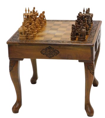 Lot 847 - An Indian hardwood chess table, the square top...