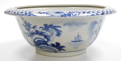 Lot 11 - A Qing dynasty style blue and white porcelain...