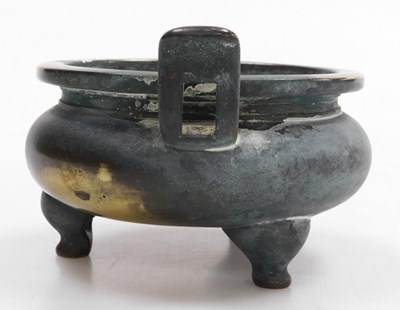 Lot 36 - A Chinese bronze censer, of twin handled,...