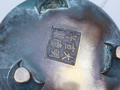 Lot 36 - A Chinese bronze censer, of twin handled,...