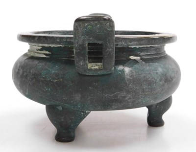 Lot 36 - A Chinese bronze censer, of twin handled,...