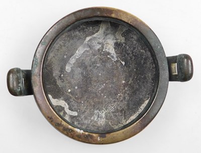 Lot 36 - A Chinese bronze censer, of twin handled,...