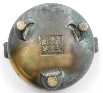 Lot 36 - A Chinese bronze censer, of twin handled,...