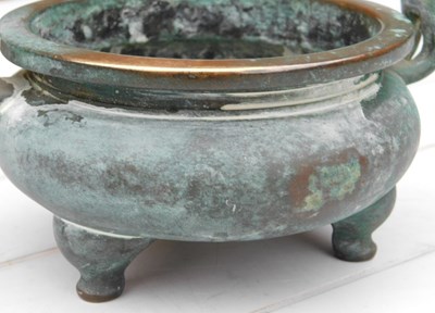 Lot 36 - A Chinese bronze censer, of twin handled,...