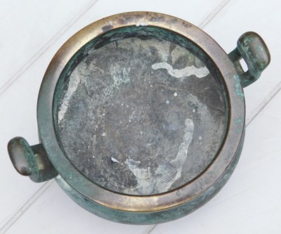 Lot 36 - A Chinese bronze censer, of twin handled,...