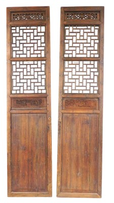 Lot 304 - A pair of 19thC Chinese carved hardwood doors,...