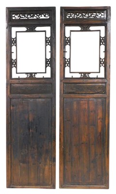 Lot 303 - A pair of 19thC Chinese carved hardwood doors,...