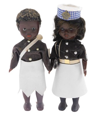 Lot 343 - A pair of plastic dolls dressed in the uniform...