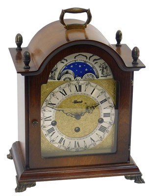 Lot 33 - A Hermle oak cased mantel clock, the dial with...