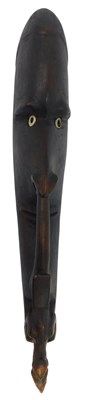 Lot 65 - Tribal Art. A carved wooden wall mask, with an...