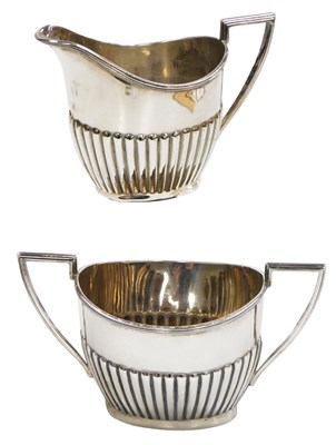 Lot 112 - A George V silver twin handled sugar bowl and...