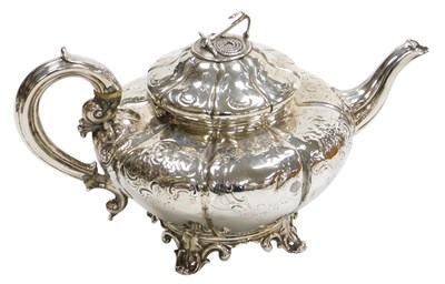 Lot 128 - A Victorian silver teapot, of fluted melon...