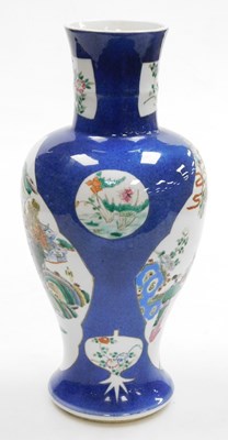 Lot 81 - A Qing dynasty powder blue ground porcelain...