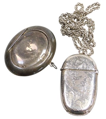 Lot 129 - An Elizabeth II silver vesta case, of oval...