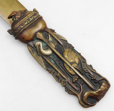 Lot 87 - A Meiji period brass and copper page turner,...