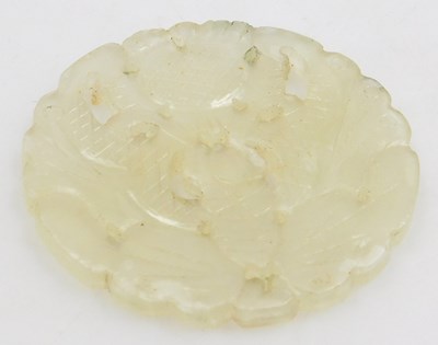 Lot 88 - A Chinese jade pendant, of circular form,...