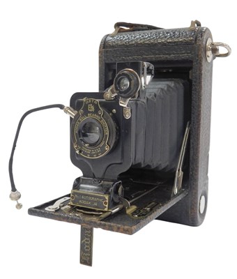 Lot 169 - A Kodak folding A-120 camera, in a leather...