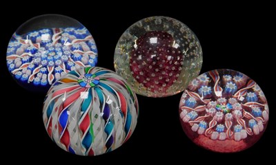 Lot 79 - Four John Deacons glass paperweights,...
