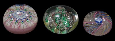 Lot 175 - Three glass paperweights, comprising a...